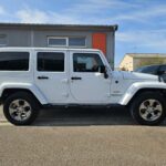 Jeep Wrangler Unlimited Sahara V6 3.6 285 ch Pentastar BVA — profil opposé