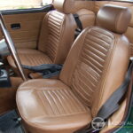 Triumph TR6 2.5 125 ch — double carburateur, overdrive — sièges avant côté conducteur