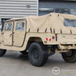 AM General Humvee M-1038 — Cargo / Transport de troupes — vue trois-quarts arrière opposée
