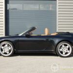 Porsche 911 type 997 Carrera 2 Cabriolet 3.6 325 ch BVM6 — profil décapoté