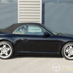 Porsche 911 type 997 Carrera 2 Cabriolet 3.6 325 ch BVM6 — profil avec capote